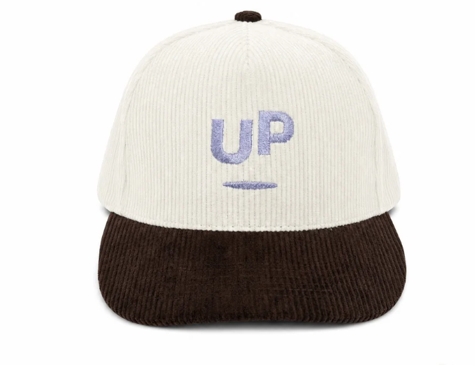 Cream and brown corduroy UP cap, front view with the lavender embroidered UP logo